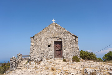 Fototapeta na wymiar Stone churh of holy spirit on top of Mount Hum in Komiza on Vis Island in Croatia