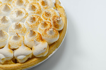 Lemon Meringue Pie, butter enriched shortcrust pastry filled with creamy lemon and topped with meringue