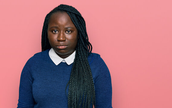 Young black woman with braids wearing casual clothes depressed and worry for distress, crying angry and afraid. sad expression.