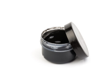 Plastic jars with paint of black color for children's creativity on white background. Paint bottles for art