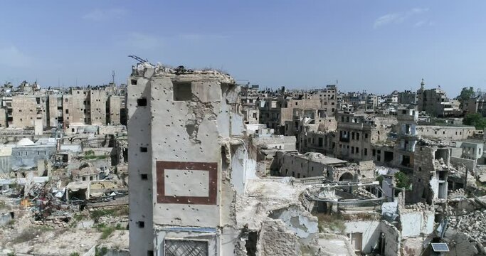 Buildings of Aleppo in Syria 10 years after the civil war. We can see ruins of building, destroyed after bombing - aerial view with a drone 4K
