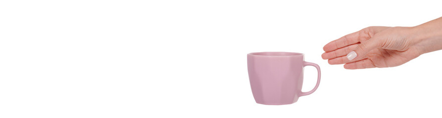 Hand with purple clay cup for tea. Isolated on white background.