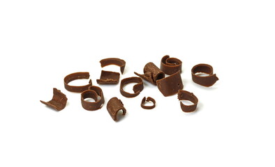 Chocolate curls isolated. Grated chocolate. Heap of ground chocolate isolated on white background with clipping path, closeup.