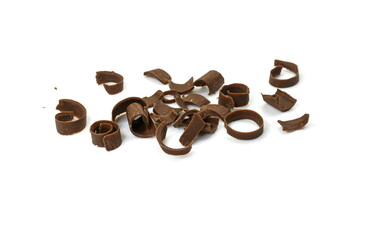 Chocolate curls isolated. Grated chocolate. Heap of ground chocolate isolated on white background with clipping path, closeup.