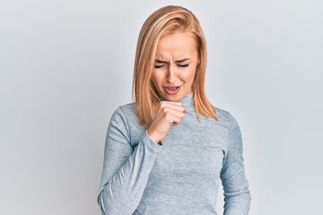 Beautiful caucasian woman wearing casual clothes feeling unwell and coughing as symptom for cold or bronchitis. health care concept.