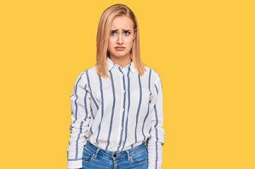 Beautiful caucasian woman wearing casual clothes skeptic and nervous, frowning upset because of problem. negative person.