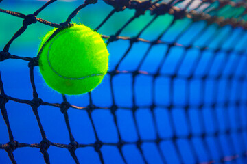 the tennis ball hits the net