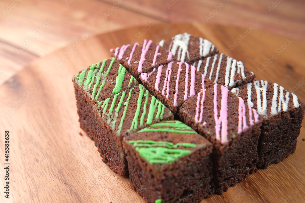 Wall mural slice of homemade brownie on plate on table 