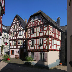 Fototapeta na wymiar Two traditional half-timbered house facades at Brückengasse street in the old town of Limburg, Germany