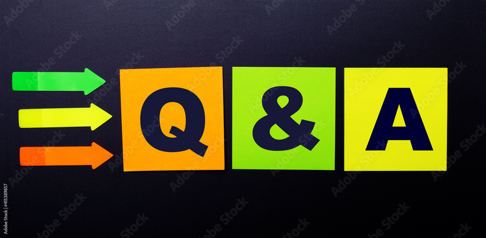 Poster bright multi-colored paper stickers on a black background with the text q and a