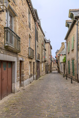 Fototapeta na wymiar Vitre, France. Stone-paved street in the historic center 
