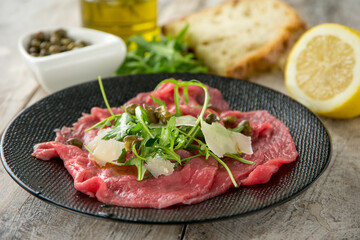 beef carpaccio with arugula capers and parmesan cheese