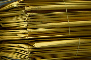 Close up, Piles or stacks of old brown envelopes on the office desktop.
