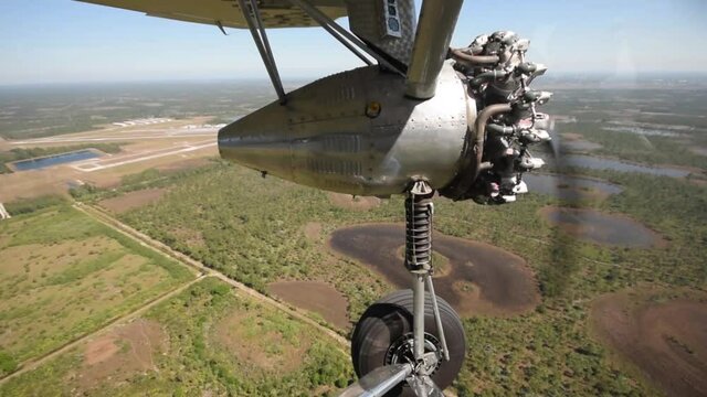 Old tri-motor airplane in flight engine view