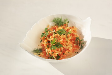 vegetarian salad of apples and carrots with dill, parsley and green onions