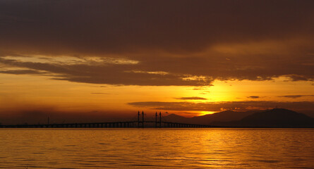 Fototapeta na wymiar Penang Bridge view during the sunrise of George Town, Penang Malaysia.