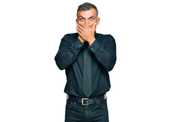 Middle age handsome man wearing business clothes shocked covering mouth with hands for mistake. secret concept.