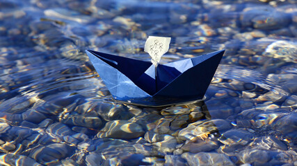paper boat floats on the river in sun glare