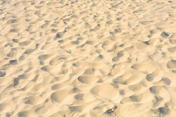 White sand on beach with footprints. Background for text, banner