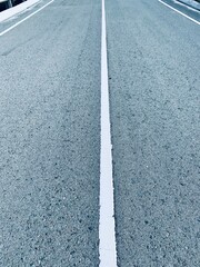 Asphalt road with white stripes