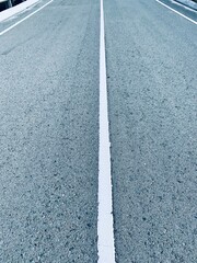 Fototapeta premium Asphalt road with white stripes
