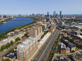 Boston Back Bay modern city skyline including John Hancock Tower, Prudential Tower, and Four Season Hotel at One Dalton Street with Charles River in Boston, Massachusetts MA, USA.  