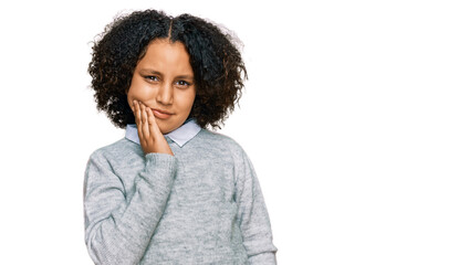Fototapeta na wymiar Young little girl with afro hair wearing casual clothes touching mouth with hand with painful expression because of toothache or dental illness on teeth. dentist