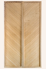 Modern wardrobe doors made of light veneer and solid oak with stylish diagonal texture on white background
