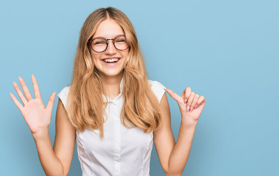 Beautiful young caucasian girl wearing casual clothes and glasses showing and pointing up with fingers number six while smiling confident and happy.