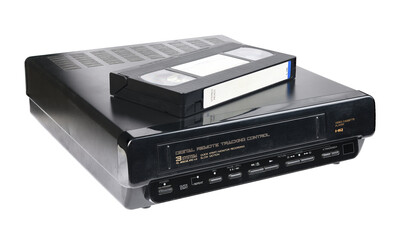Fototapeta premium Old videocassette recorder 1980s-1990s with videotape isolated on white background. foreground