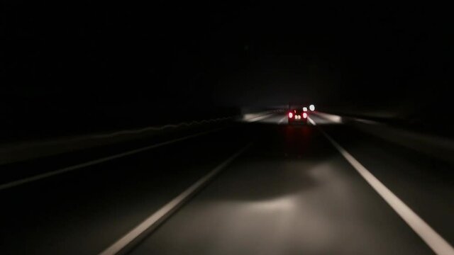 Driving at night on a highway. Time lapse footage