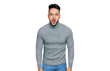 Naklejka premium Young arab man wearing casual clothes afraid and shocked with surprise expression, fear and excited face.