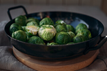 brussel sprouts in metal bowl on table