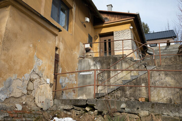 Family house and residential building in Czech Republic, Central and eastern Europe. Authentic poor housing - ugly, dilapidated, aged. 