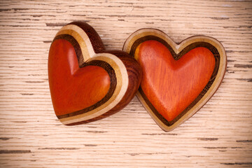 Two wooden hearts on rustic wood background. Valentines days concept.  Love symbol. Greeting card.