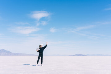 Obraz premium Unrecognizable woman in headset against cloudy sky