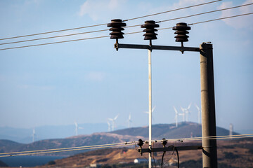concept idea eco power energy. wind turbines on the hill generates electricity and these electric...