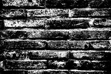 Texture of old dark scary dirty crumbling brick wall of ancient city. Uneven pitted surface of the brickwork of the damp basement with holes and worn. Decayed burnt brickwall background for 3D design