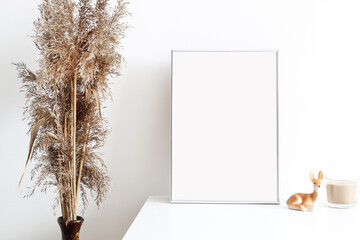 picture frame mockup in white simple interior with dry grass and candle