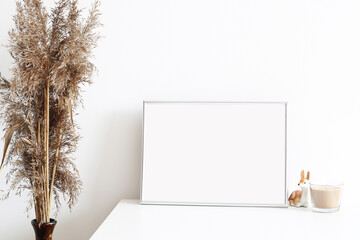 picture frame mockup in white simple interior with dry grass and candle