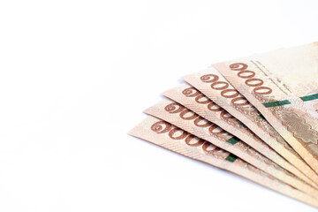 money banknote thai 1000 baht on white background, savings money and financial business concept, copy space