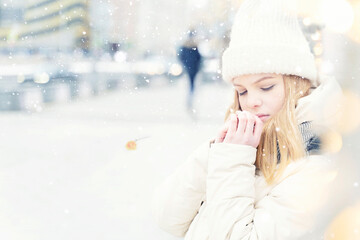 divorce concept. beautiful caucasian girl in white warm clothes is sad and suffering. silhouette of a leaving man in the distance and a flower brooch on the snow