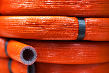 Foamed polyethylene material. Insulation hose for sanitary pipes. Close-up. Selective focus