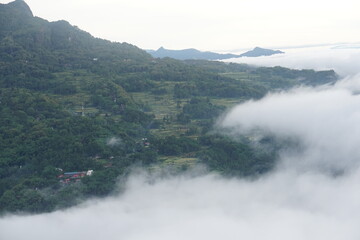A breathtaking view when seeing beautiful morning light and the sea of fog at Lolai, Toraja Utara, Indonesia. This is the best place to see a sunrise