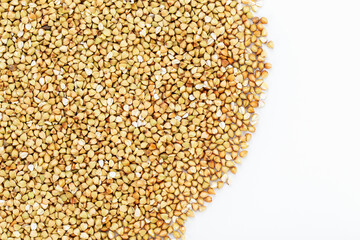 Dried buckwheat on a white background. Healthy food.