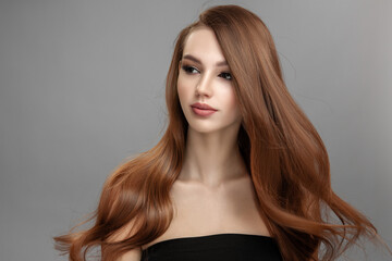 Beautiful woman with flying hair. Long hair hairstyle and makeup