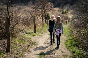 Fototapeta premium two children walking together free in the nature