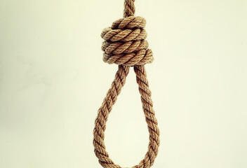 Braided thick rope tied in a skein. Hemp rope for decoration and design. Background from a fishing rope.