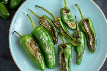 Green fresh chili peppers padron grilled or fried in the Spanish style