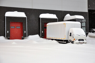 Heavy snowfall. Delivery of goods to the warehouse logistics complex is complicated.